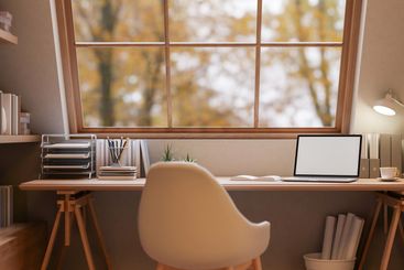 A cozy, minimalist woody home office workspace features...