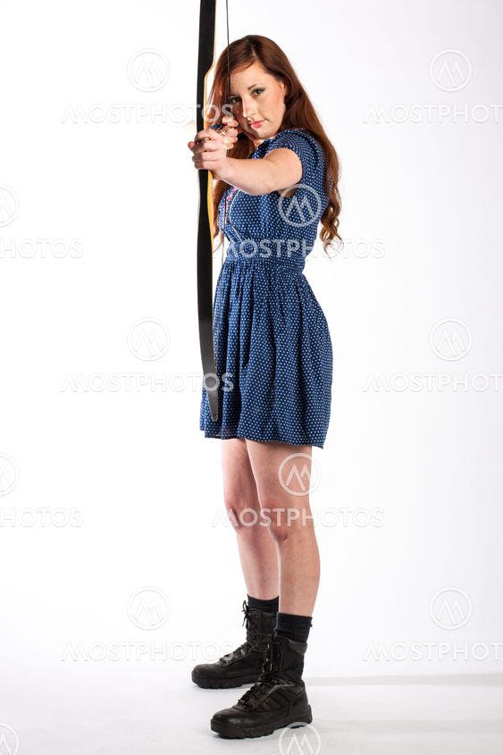 Redhead Takes Aim with Bow