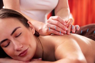 Female Patient Receives Chiropractic Adjustment