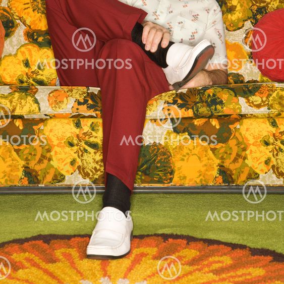 Man sitting on sofa.