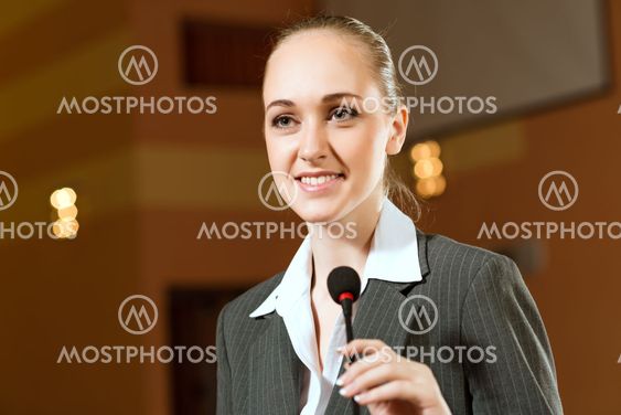 Portrait of a business woman with microphone