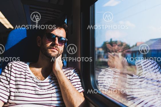 Young man traveling on a train