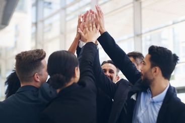 Business people, high five or hands together for...