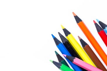 Colorful drawing pencils arranged artistically on a...