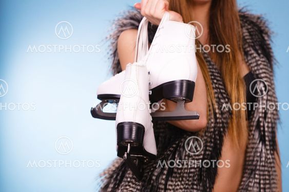 Attractive lady with ice skates.