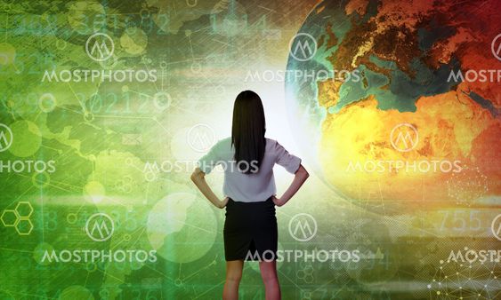 Business woman in front of holographic screen