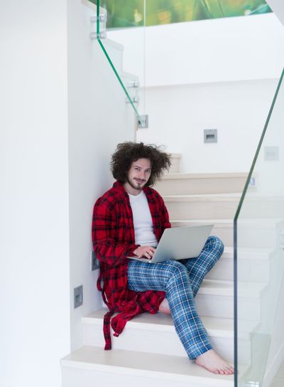 freelancer in bathrobe working from home