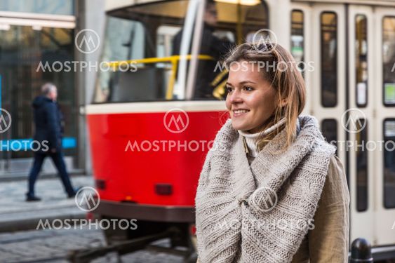 Young Woman at Tram Stop
