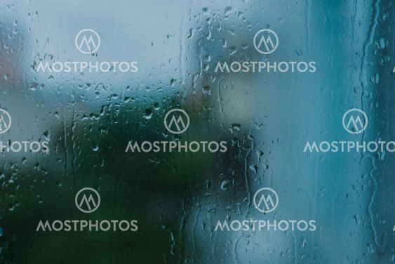drops of rain water on the glass