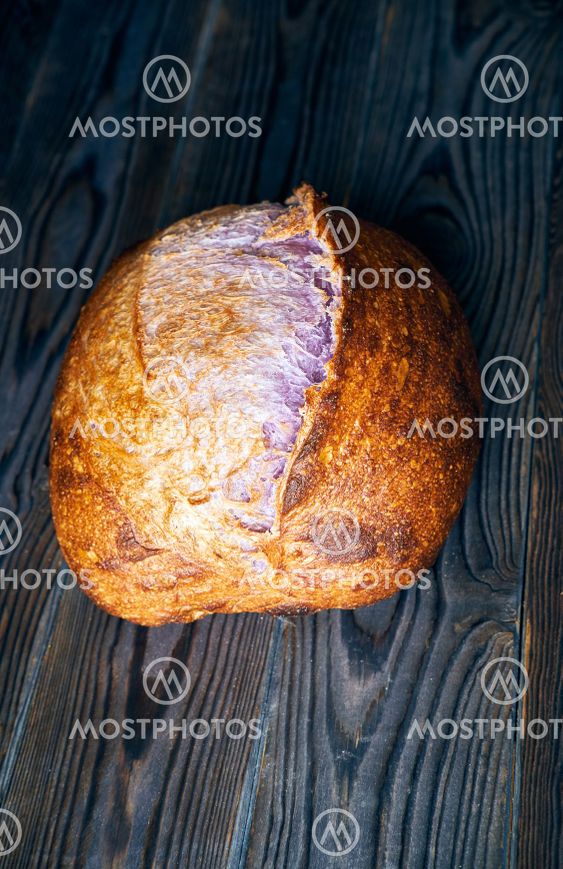 Homemade tartine bread on dark wooden table
