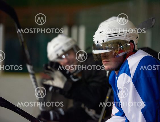 ice hockey players on bench