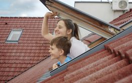 Happiness of a mother and her son as they open attic...