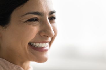 Cropped closeup beautiful young female face with...