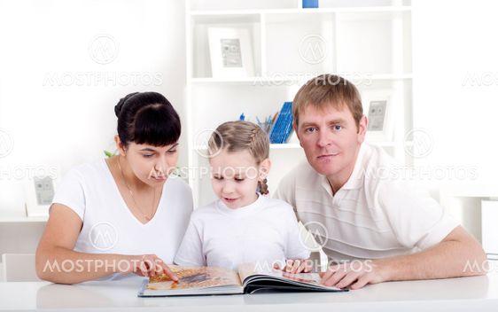 Family reading a book together