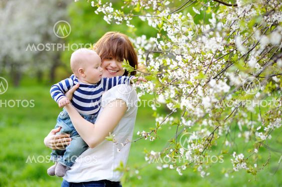 Little baby boy with her young mother