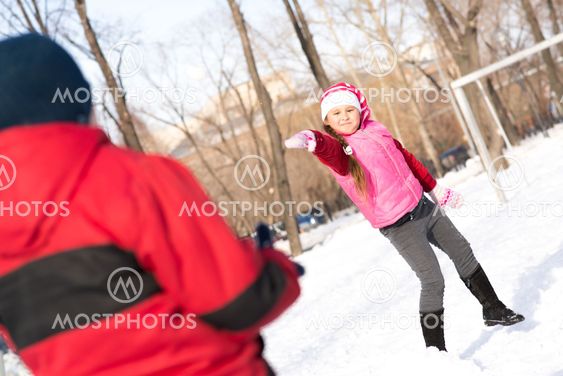 Children in Winter Park playing snowballs