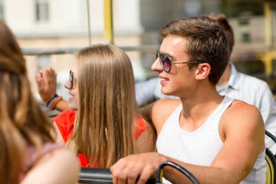 smiling couple traveling by tour bus