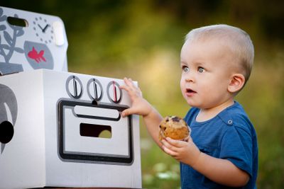 Little boy playing with toy oven