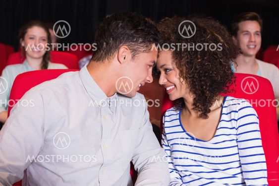 Young couple watching a film