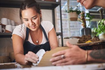 People, team and pottery in creative studio, working...