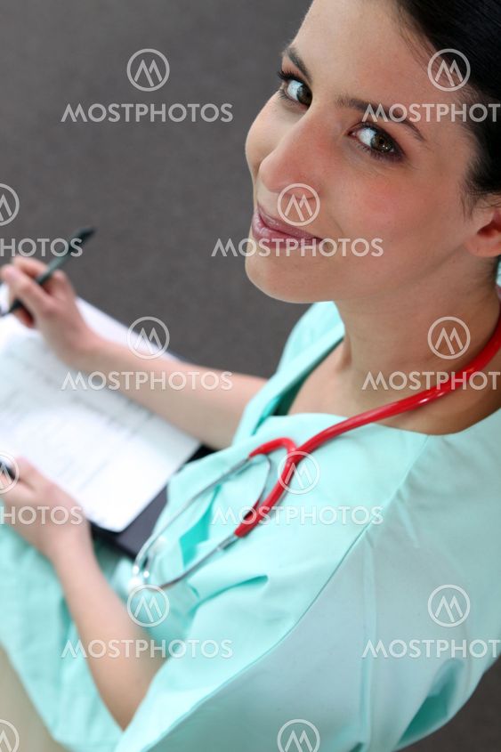 Female doctor taking notes