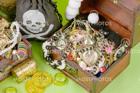 two small boxes with treasures on a light green background