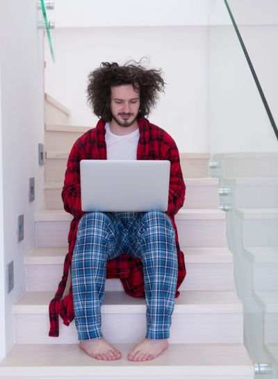 freelancer in bathrobe working from home