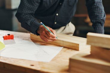 Pencil, carpenter hands and mark wood to measure for...