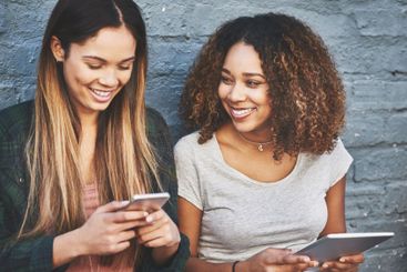 Wall, smile or women with phone or tablet for gossip,...