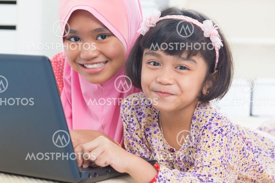 Asian children surfing internet