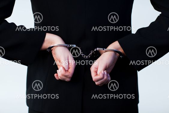 Business person handcuffed