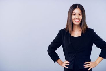 Business woman, portrait and space in studio with smile,...