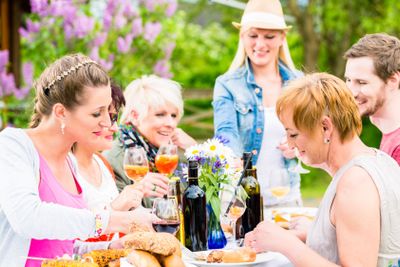 Friends eating bbq sausage and meat