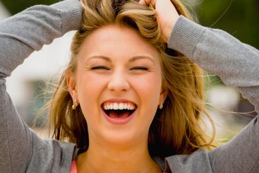 Happy teenage girl laughing