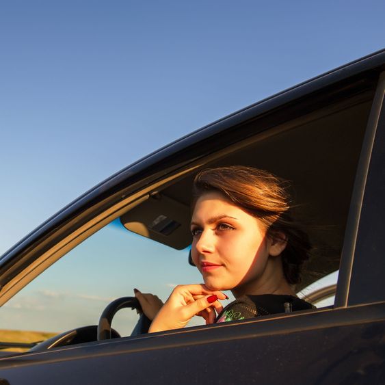 woman drives a car