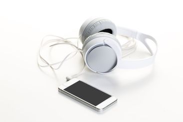 White headphones on white background close up