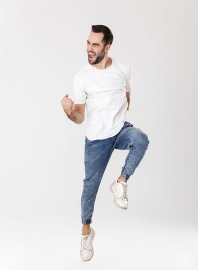 Full length of a handsome cheerful man