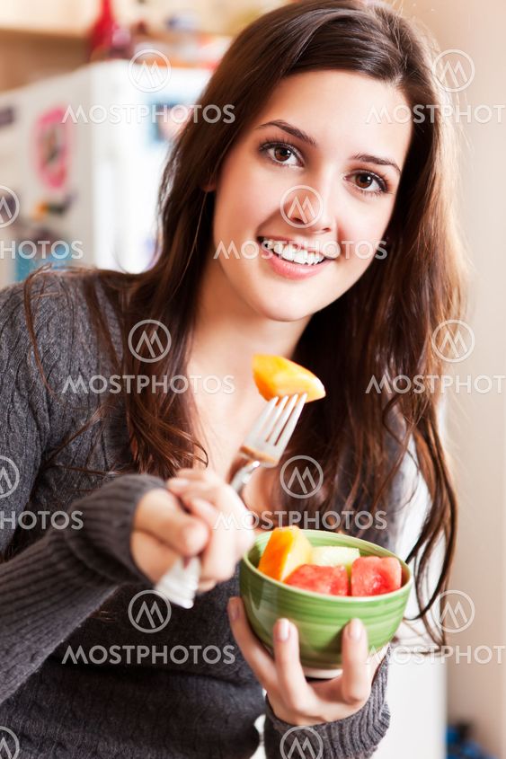 Woman holding a fruit bowl