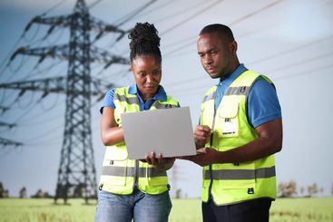 Engineers Using Computer Technology New Energy Tower