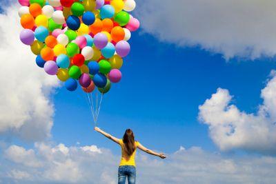 Girl with colorful balloons