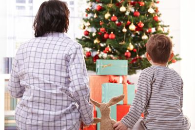 Mother, toy and son on christmas morning�