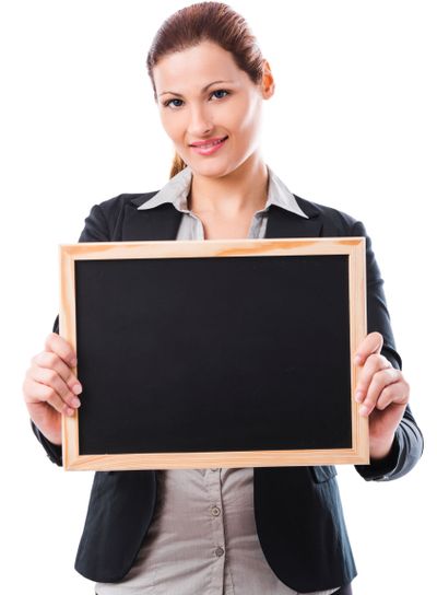 Business woman holding a chalk board