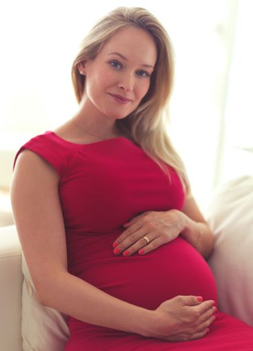Relax, pregnant and woman in portrait on sofa,...