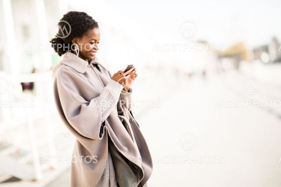 Young black woman taking selfie outdoor