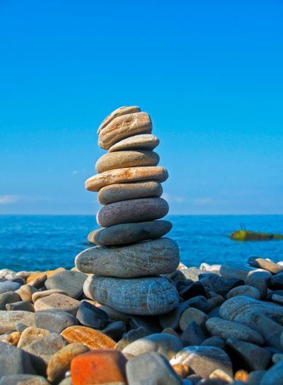Balanced stones on the seashore summertime