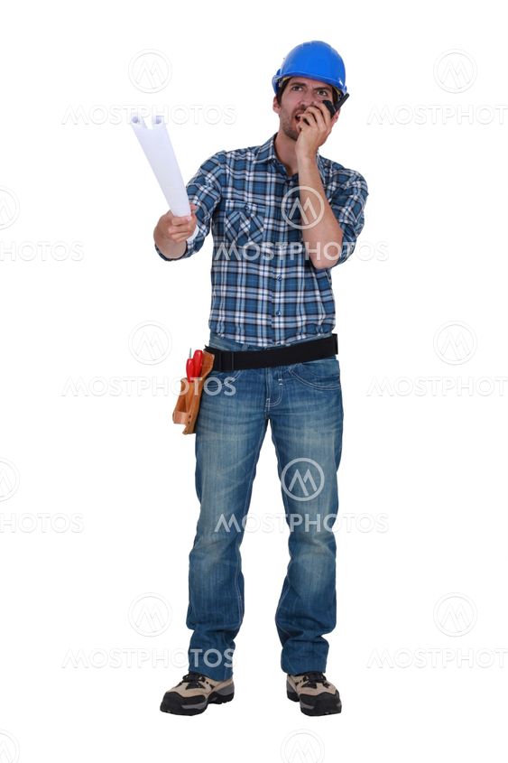 Workman with plans and a walkie talkie