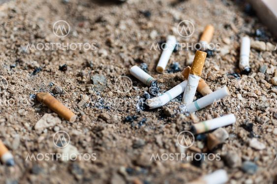 cigarette butts in ashtray sand truck