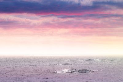 Partly cloudy panorama in vivid colors at seashore with...