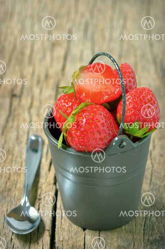 Fresh strawberries in bucke