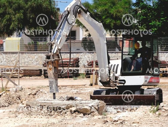 Excavator with demolition hammer